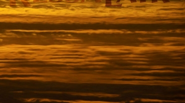 Golden clouds like waves from If Loneliness Were a Person Poem at KessaLair